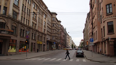 A typical long straight street of Riga Centrs, surrounded by large old buildings