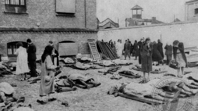 Latvians attempt to recognize the mutilated bodies of their relatives who were murdered by Soviets in Riga