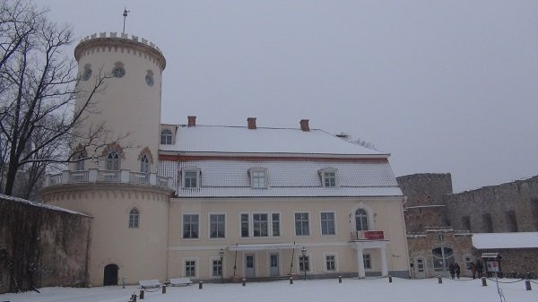 Castle-like 19th century Cēsis palace, with ruins of Medieval castle on the right