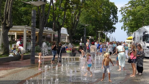 People enjoying summer in a main street of Majori village