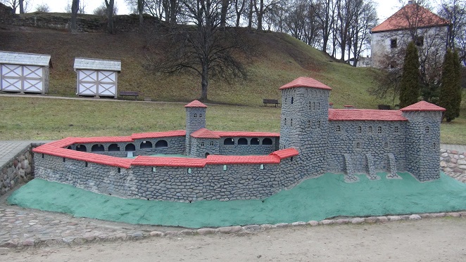 A model of Kandava Castle under the hill where the ruins of the original one remain
