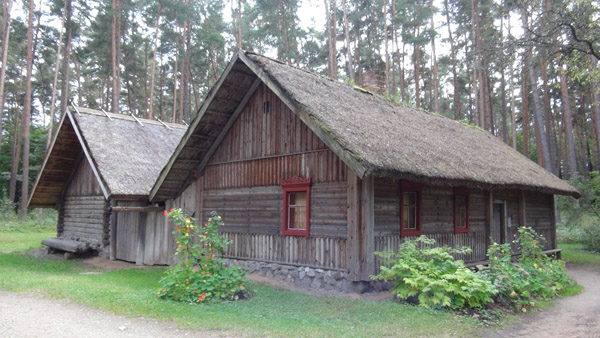 A Russian farmstead moved to Riga Skansen from Latgale, with iconic red window decorations