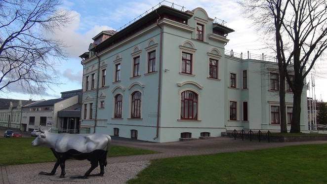 One of Ventspils cows in front of the port administration building in Old Town